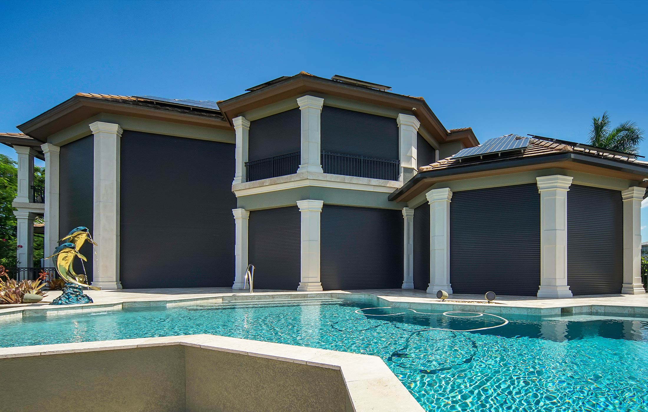 Custom roll-down hurricane shutters Custom roll-down hurricane shutters on a home in Cape Coral – Shutter Specialists